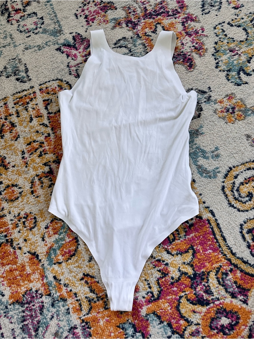 White Sleeveless One-Piece Bodysuit